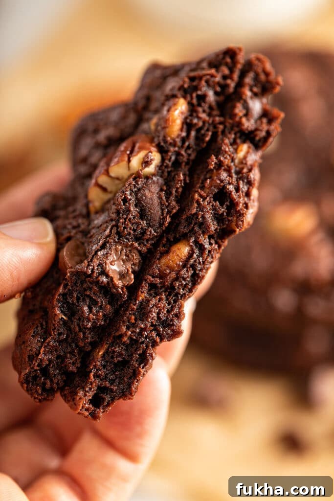 Double Chocolate chip cookie cut in half, showing the chewy center.