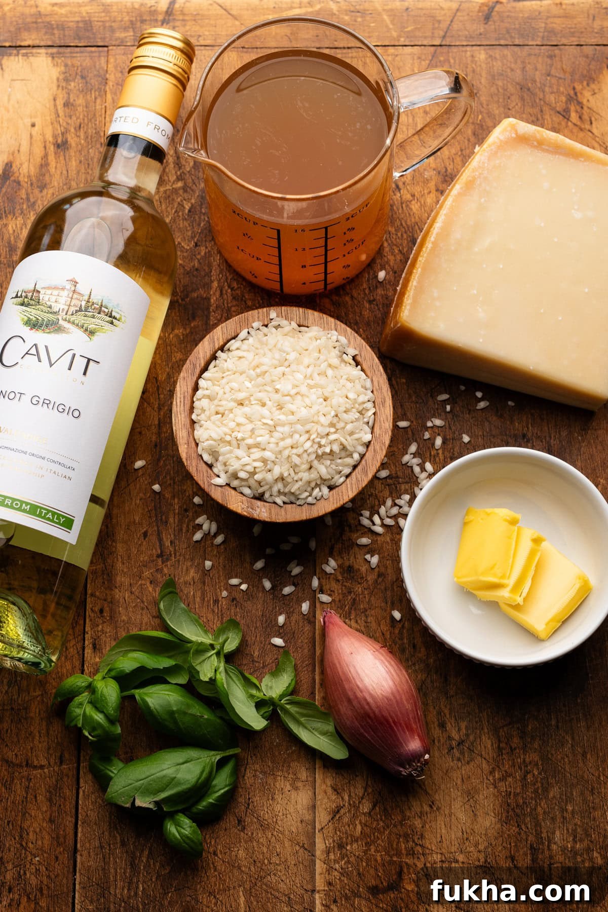 Ingredients for risotto on a wooden board
