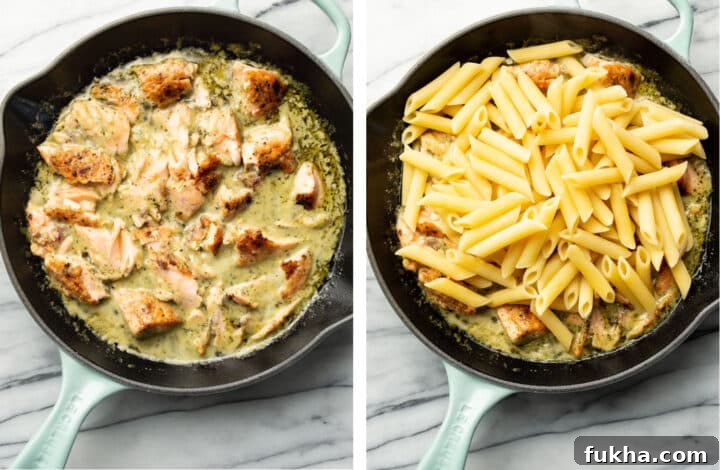 breaking up salmon in a skillet into pieces and tossing with penne to make salmon pesto pasta