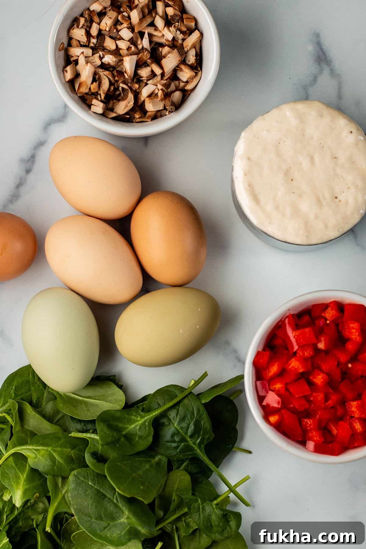 Sourdough Starter Breakfast Bites Recipe 3 Diced mushrooms and peppers, eggs, sourdough starter and spinach.