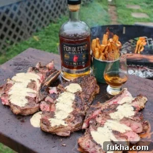 Steak with Peppercorn Cream Sauce and Pendleton Midnight Whisky served up.
