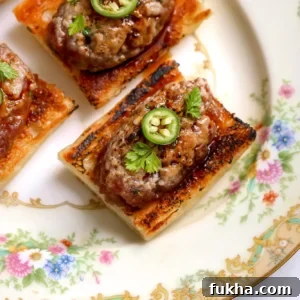 Overhead view of tuna tartare on toasted baguette with serrano and herbs