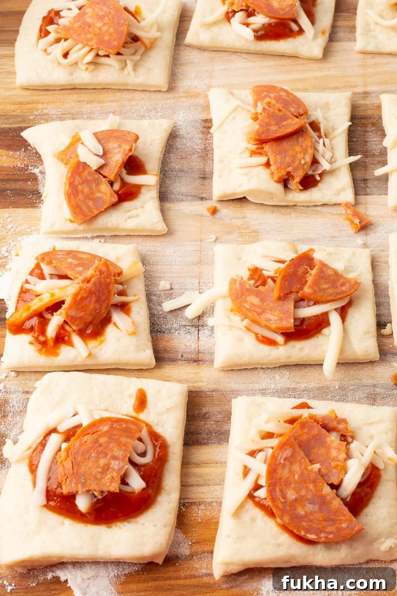 Homemade Pizza Poppers Recipe: Crispy Cheesy Bites 4 Forming pizza poppers on a floured surface
