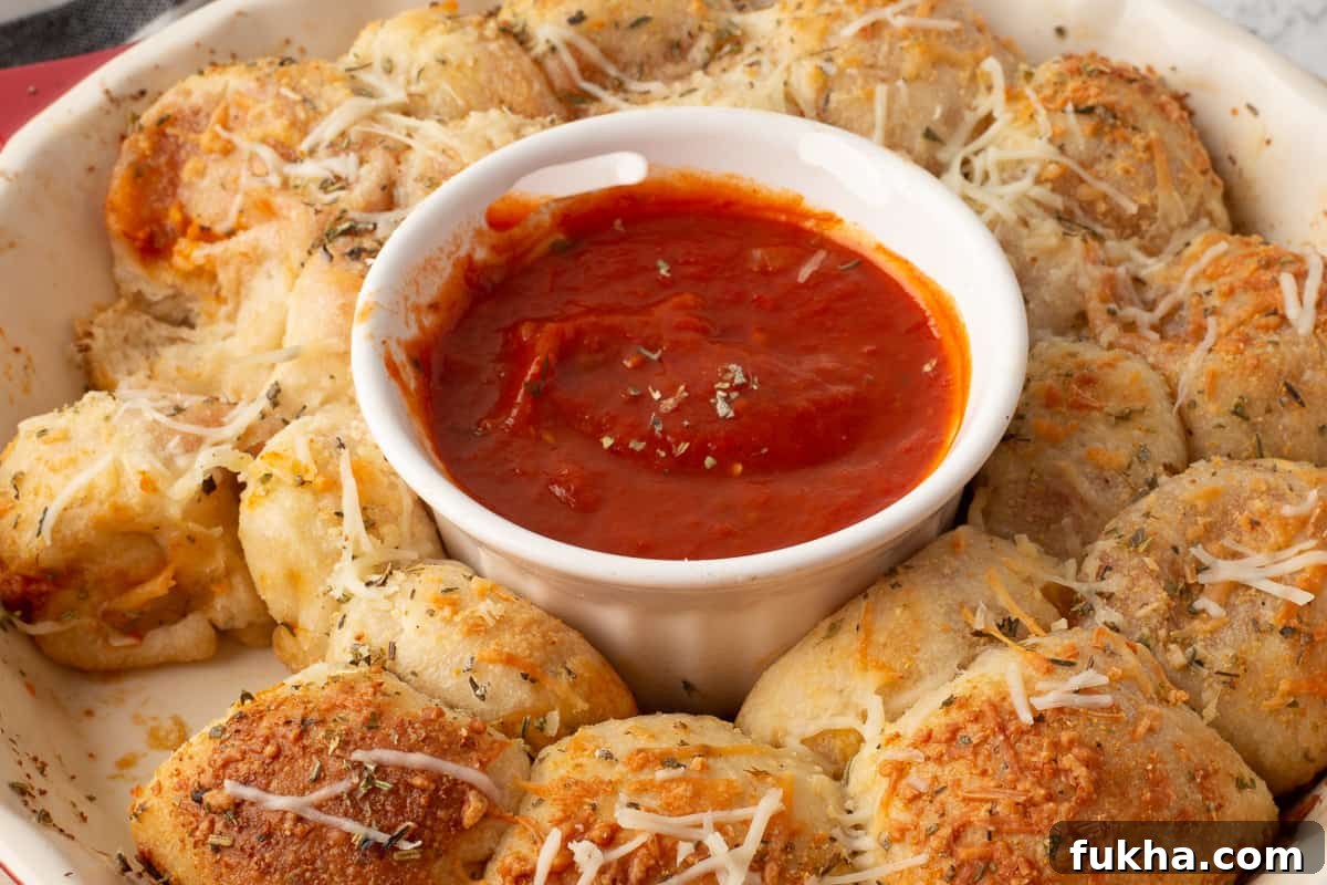 Homemade Pizza Poppers Recipe: Crispy Cheesy Bites 5 Baked pepperoni pizza poppers in a red dish