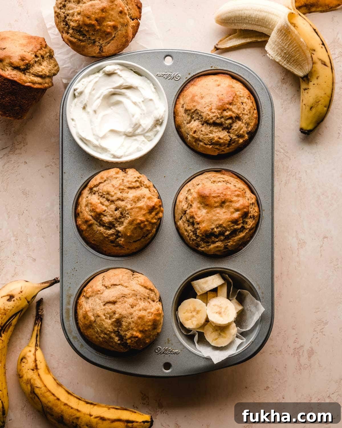 Sour cream banana muffins in muffin tin.