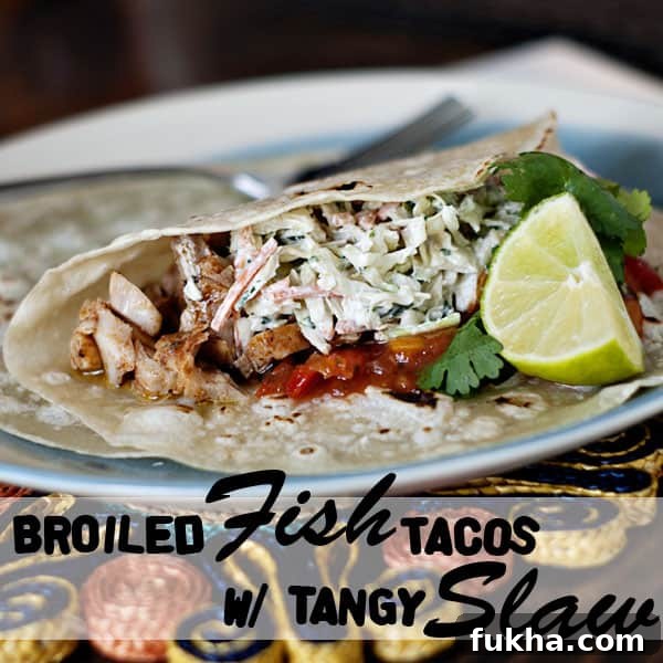 Broiled Fish Tacos with Tangy Slaw on a blue and white plate
