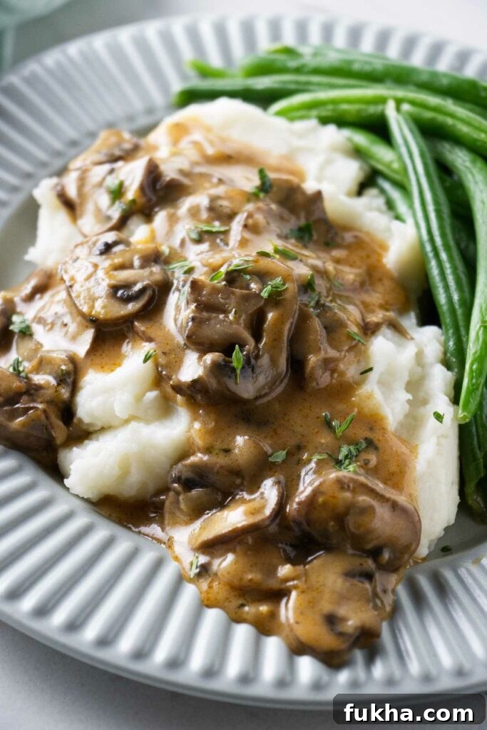 Marsala sauce on top of a serving of mashed potatoes.