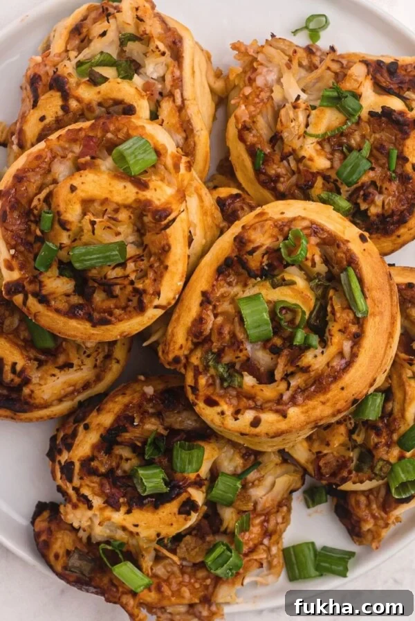 Golden bbq bites with chicken, mozzarella cheese, and topped with green onions.