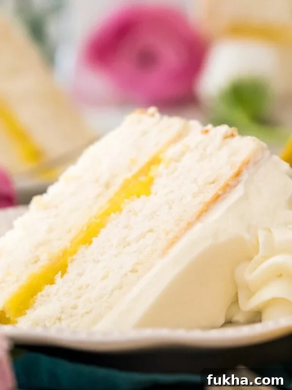 Decadent Chantilly Cream Cake Recipe 11 lemon cake on white plate