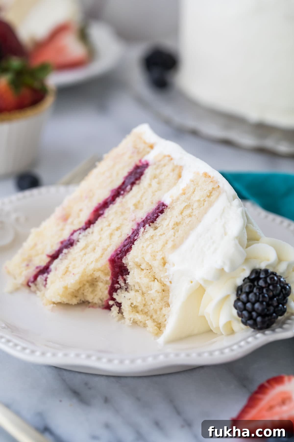 Decadent Chantilly Cream Cake Recipe 9 Slice of chantilly cake with a bite missing from it