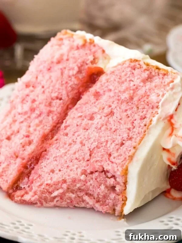 Decadent Chantilly Cream Cake Recipe 10 pink strawberry cake on white plate