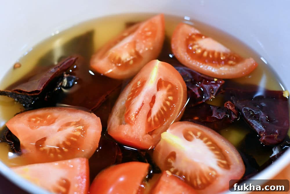 24Bite: Homemade Tamale Sauce Tomatoes and Chiles simmering