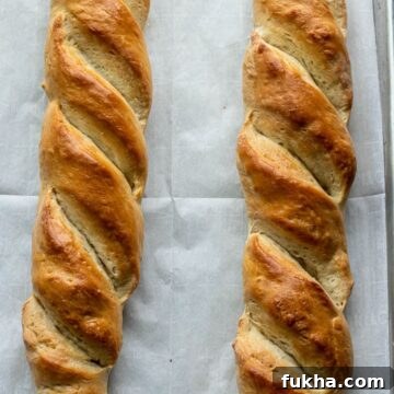 French bread loaves on large baking sheet