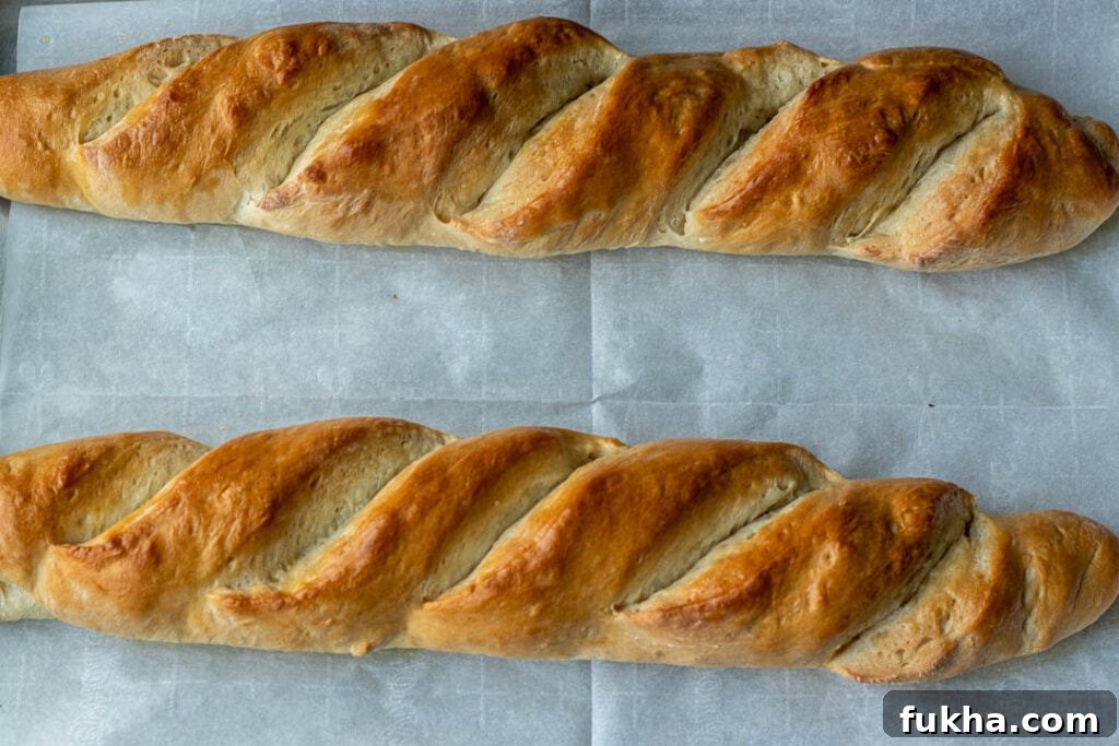 Freshly baked homemade French bread on baking sheet