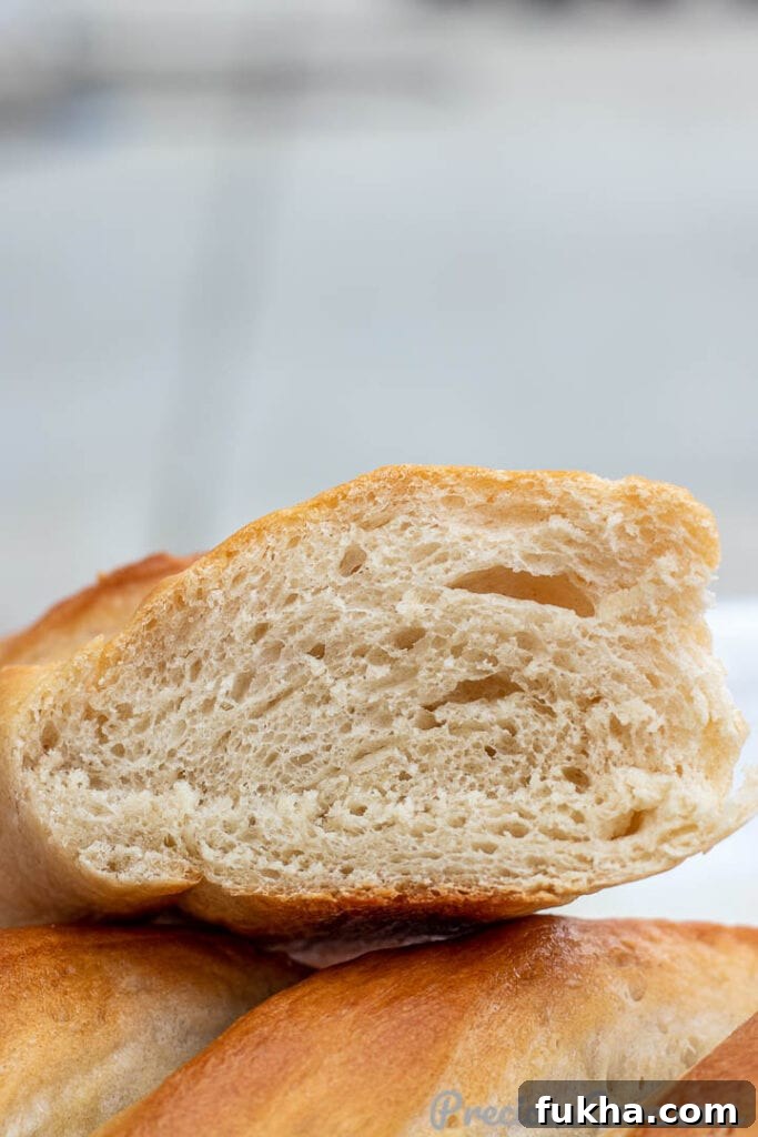 Cut loaf of French Bread showing airy texture