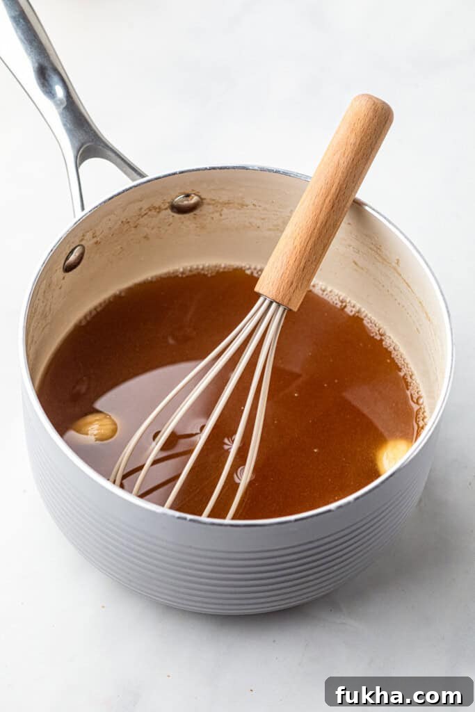 Glaze for Pulled Pork Ham in saucepan with whisk