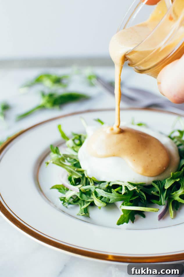 Easy dairy free tahini hollandaise sauce! So simple to make (in a blender!) and still full of healthy fats and delicious flavor for your endless list of things that you have just been waiting to drown in hollandaise goodness.