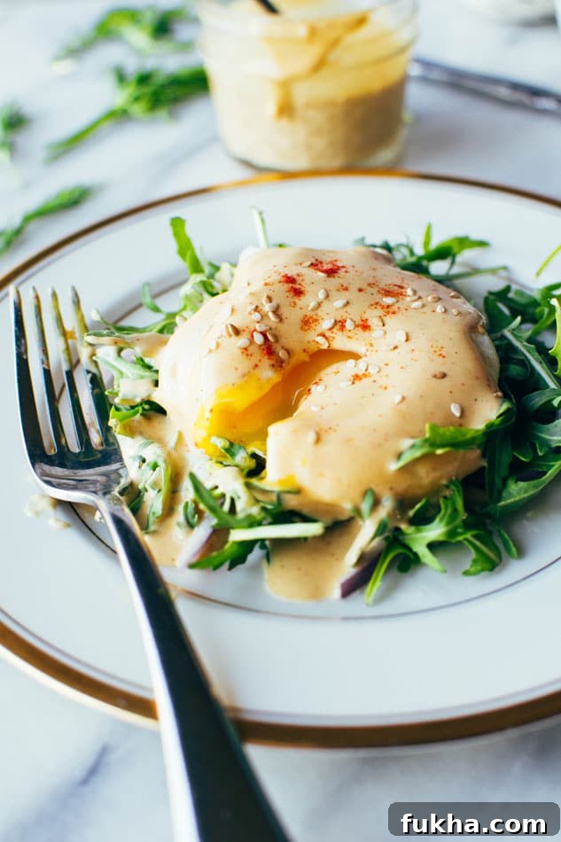 Easy dairy free tahini hollandaise sauce! So simple to make (in a blender!) and still full of healthy fats and delicious flavor for your endless list of things that you have just been waiting to drown in hollandaise goodness.
