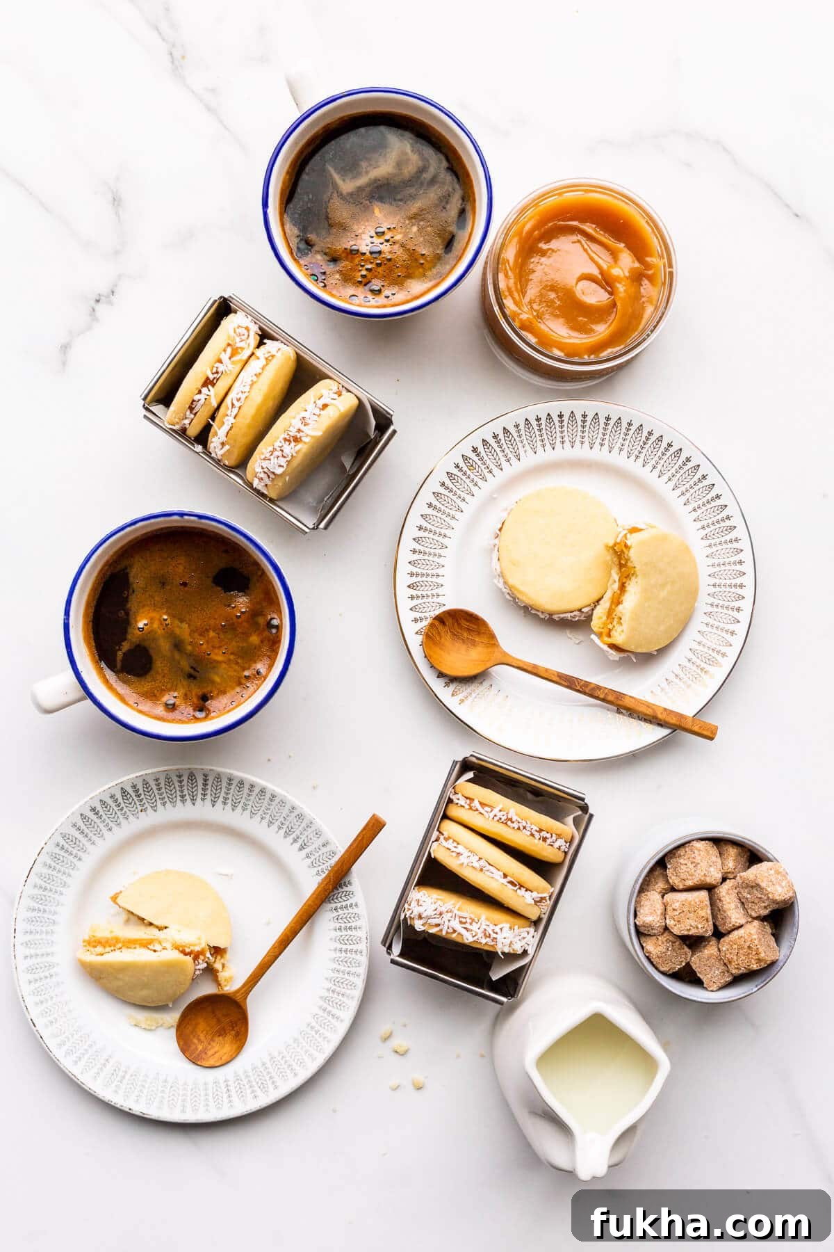 Classic Argentinian Alfajores Recipe with Dulce de Leche 12 Alfajores sandwich cookies coated in coconut and served with coffee.