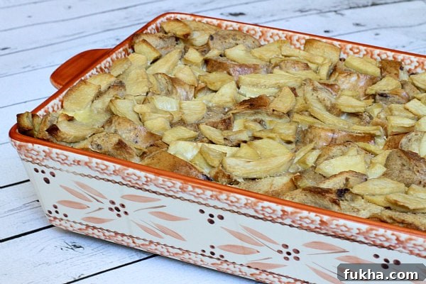 Caramel Apple Bagel Bread Pudding in a casserole dish