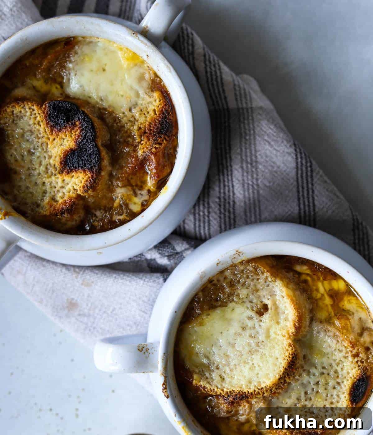 Two soup bowls filled with cheese.
