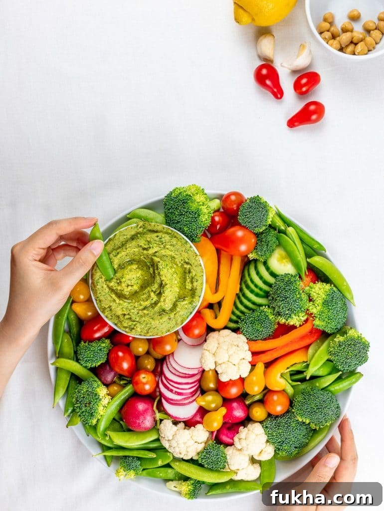Tahini-Free Cilantro Jalapeno Hemp Seed Hummus 3 cilantro jalapeno hemp seed hummus surrounded by a vegetable platter