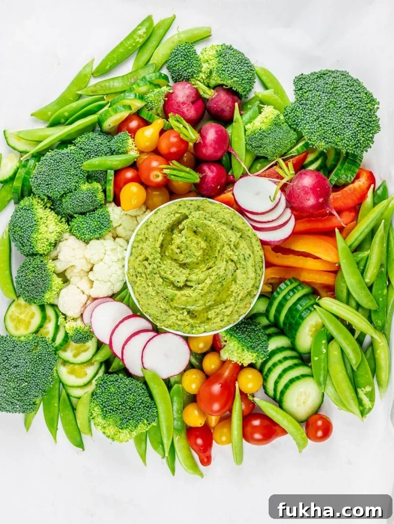 Tahini-Free Cilantro Jalapeno Hemp Seed Hummus 6 cilantro jalapeno hemp seed hummus surrounded by a vegetable platter