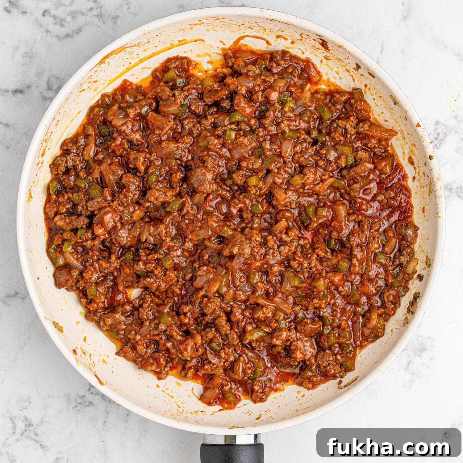 Sloppy joe meat sauce in a white pan