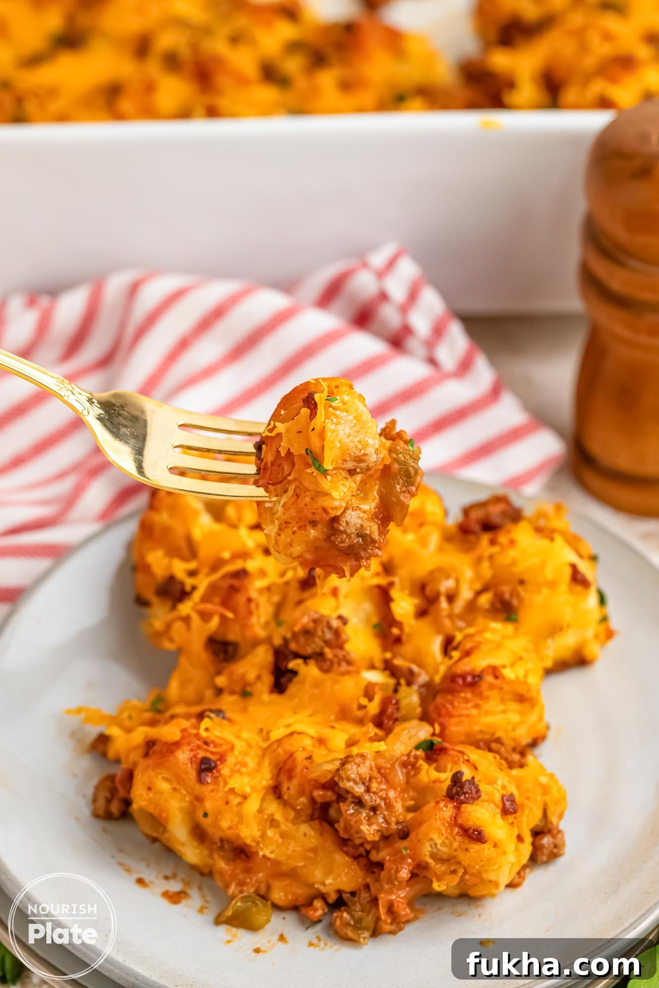 Plated Sloppy Joe Bubble Up Casserole with a fork