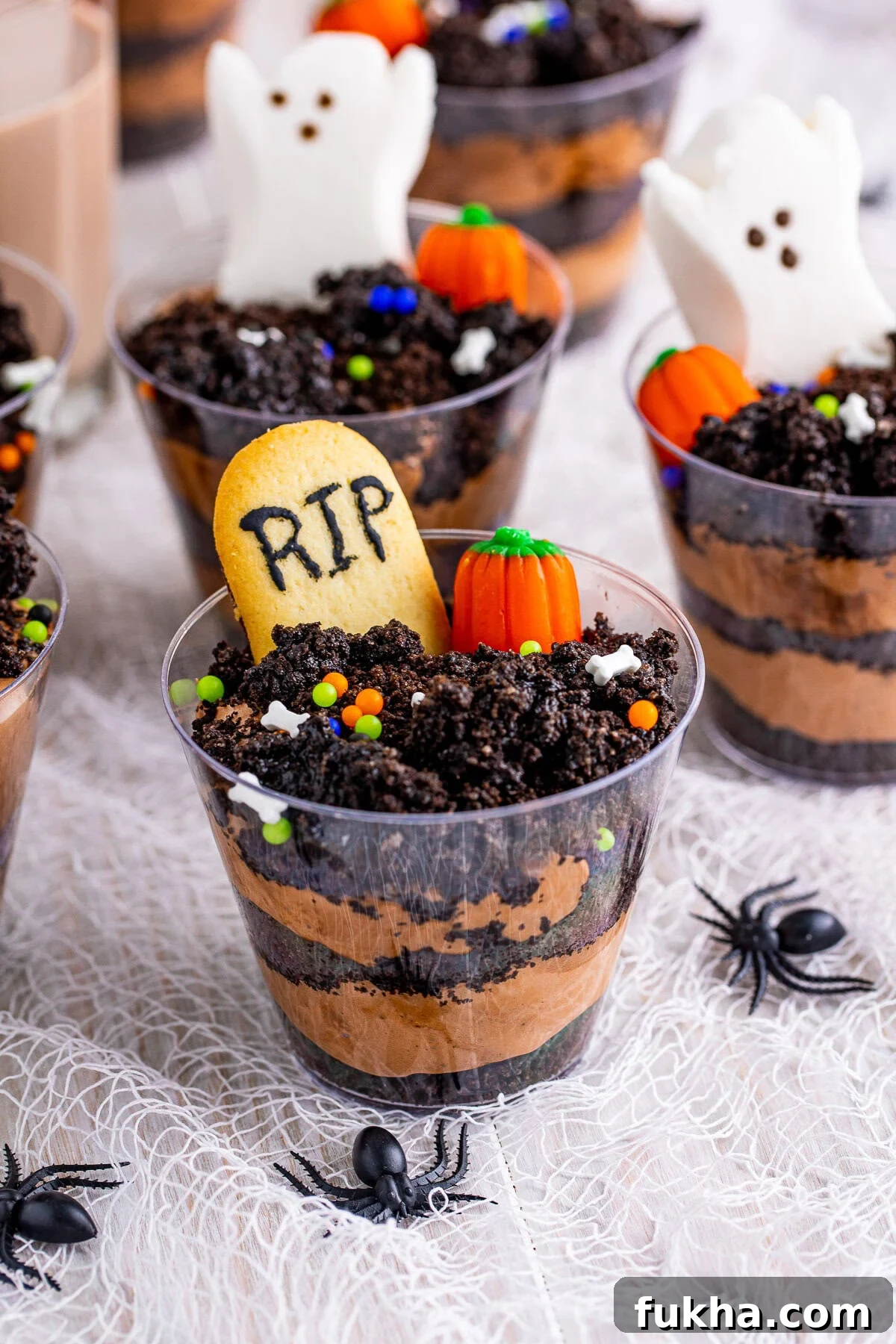 Graveyard Dirt Cups Recipe for Halloween 2 Close up of one of the Graveyard Dirt Cups showing garnishes.