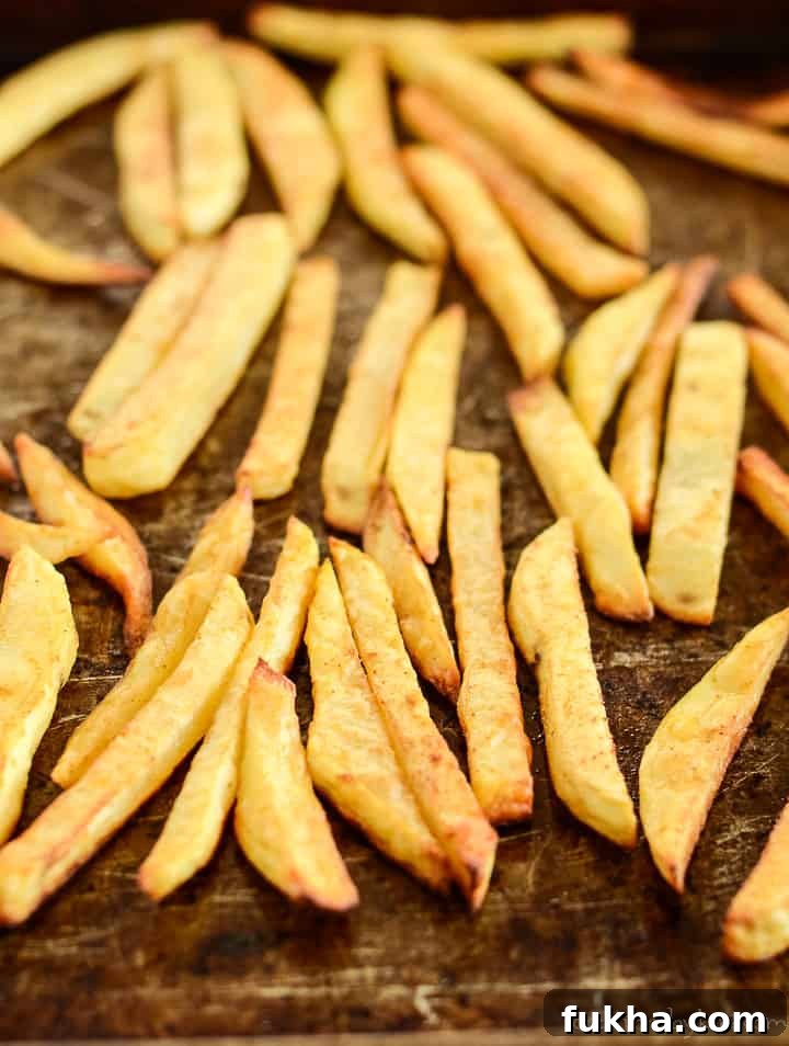 pan of baked steak fries seasoned and crispy