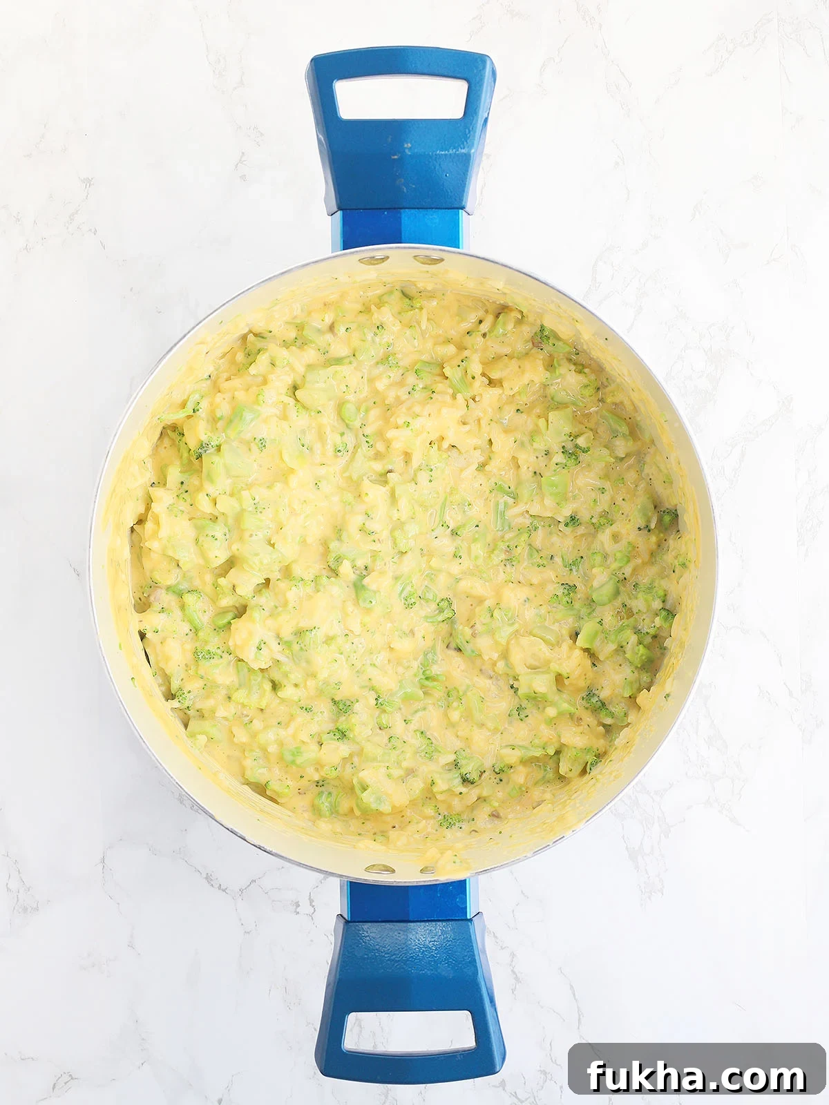 Creamy Broccoli Cheese Casserole 7 broccoli, rice, and cheese sauce mixed together in a large stock pot