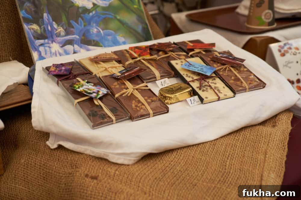 24-Hour Berlin Food Guide: What to Eat in a Day 11 Artisan chocolate bars on display at a booth at an outdoor market.