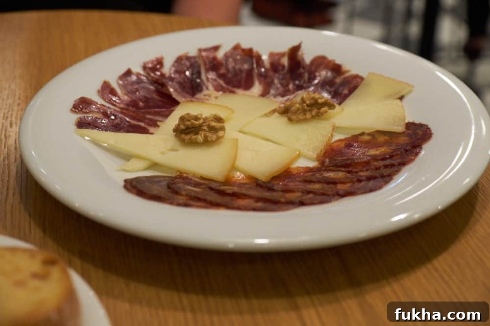 24-Hour Berlin Food Guide: What to Eat in a Day 15 A plate of Spanish cheese and charcuterie.