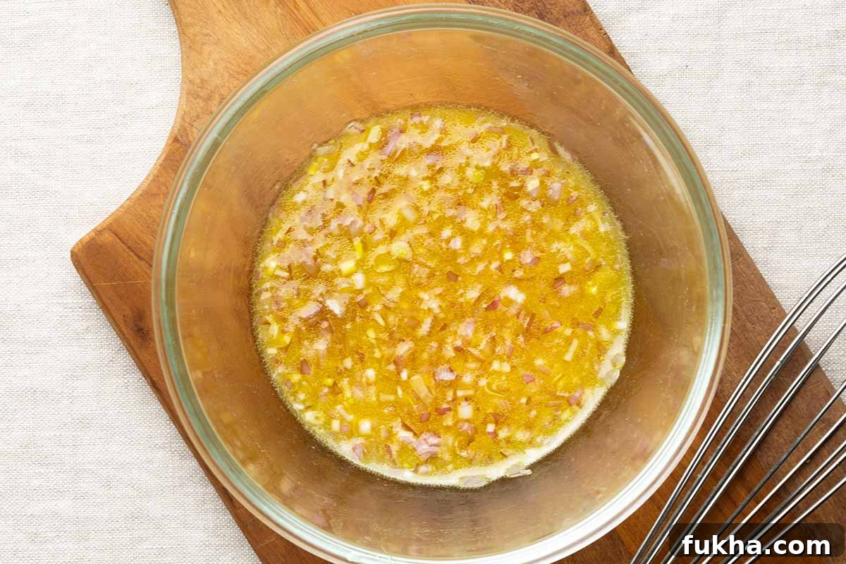 vinaigrette emulsified in a glass bowl.