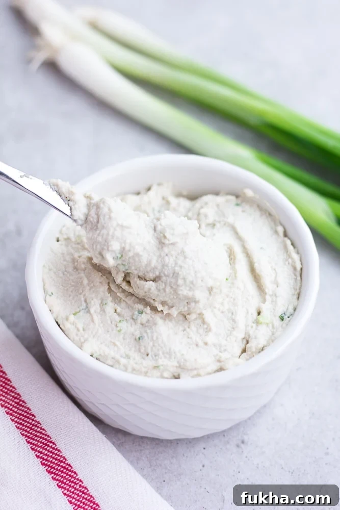 5-Minute Vegan Cream Cheese Recipe 5 vegan cream cheese in a bowl with a knife