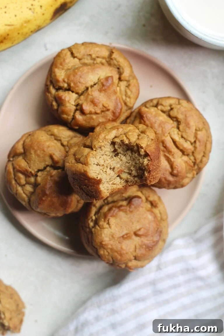 muffins on a plate with bite taken out