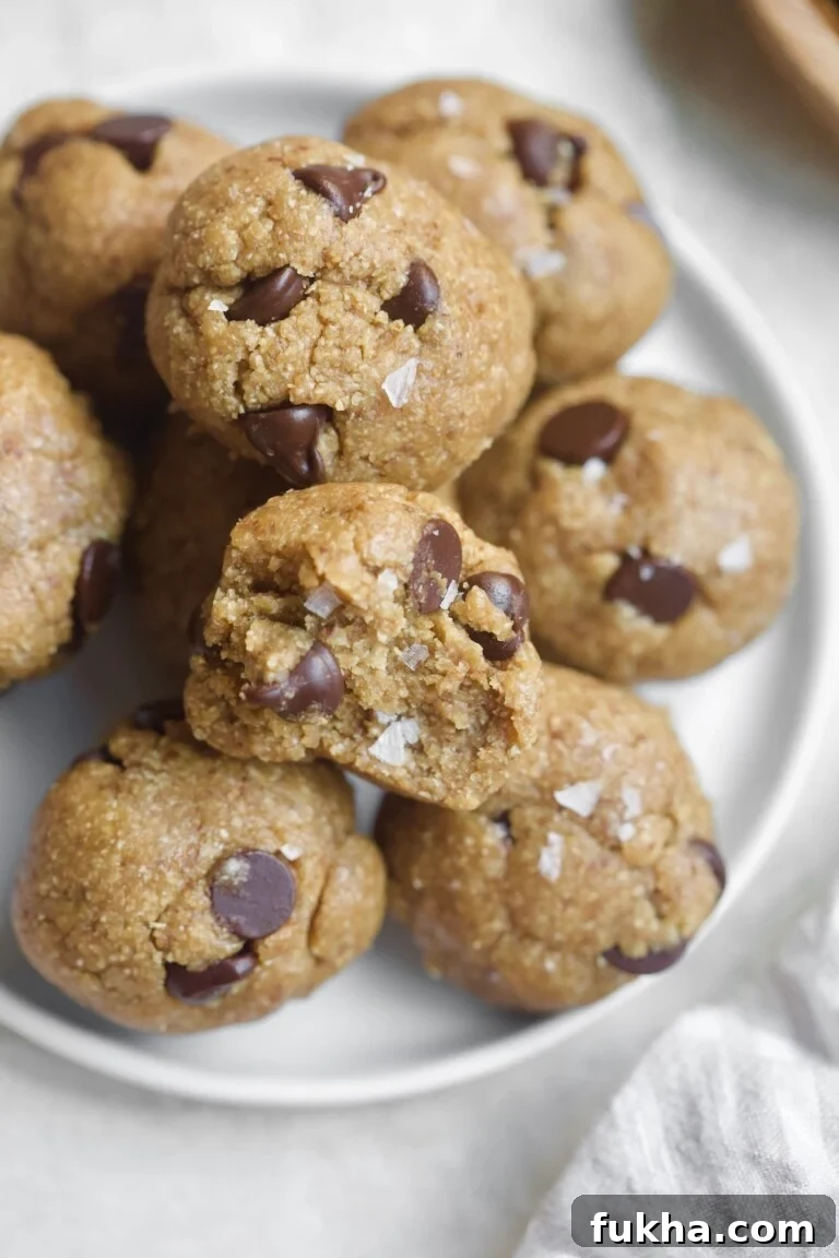 chocolate chip cookies on plate with bite taken out