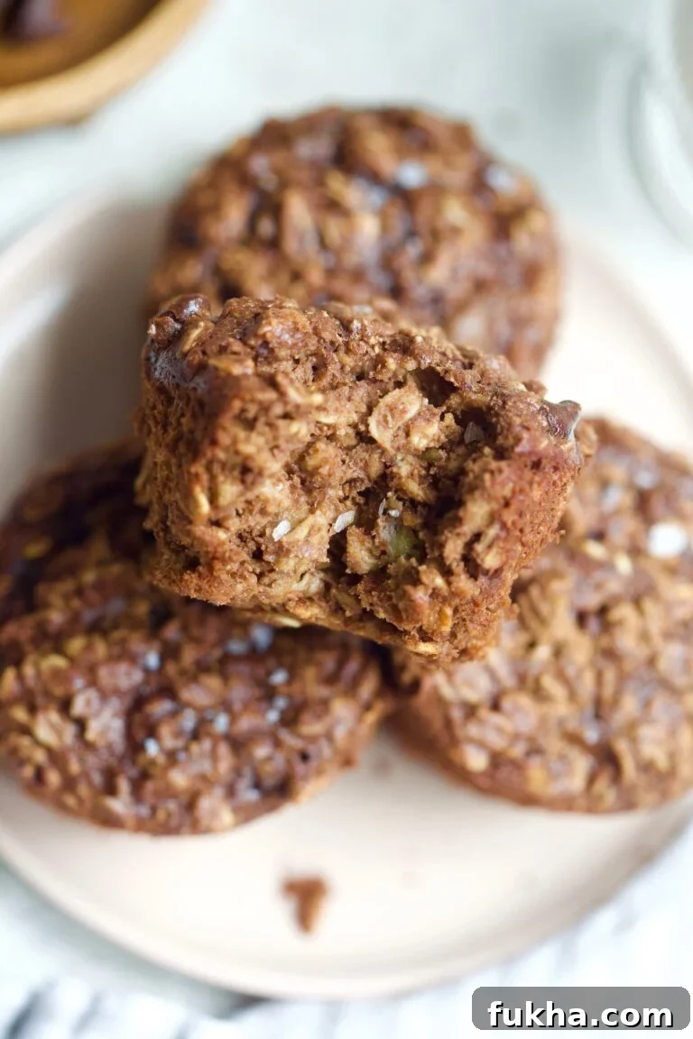 oatmeal cups on plate with bite taken out.