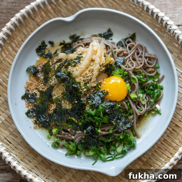 Makguksu with perilla oil, kimchi, and egg yolk