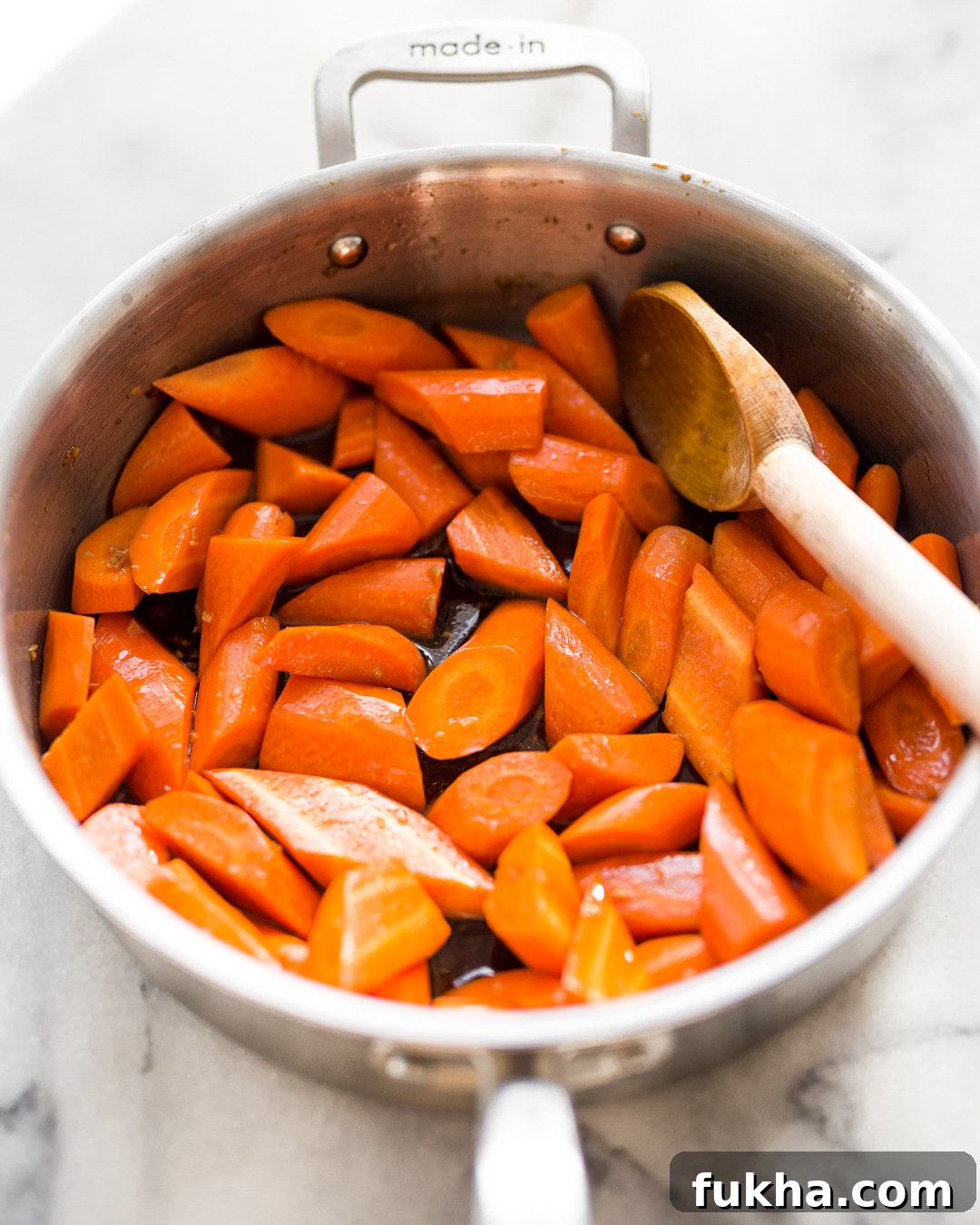 Caramelized maple sesame carrots on a sheet pan