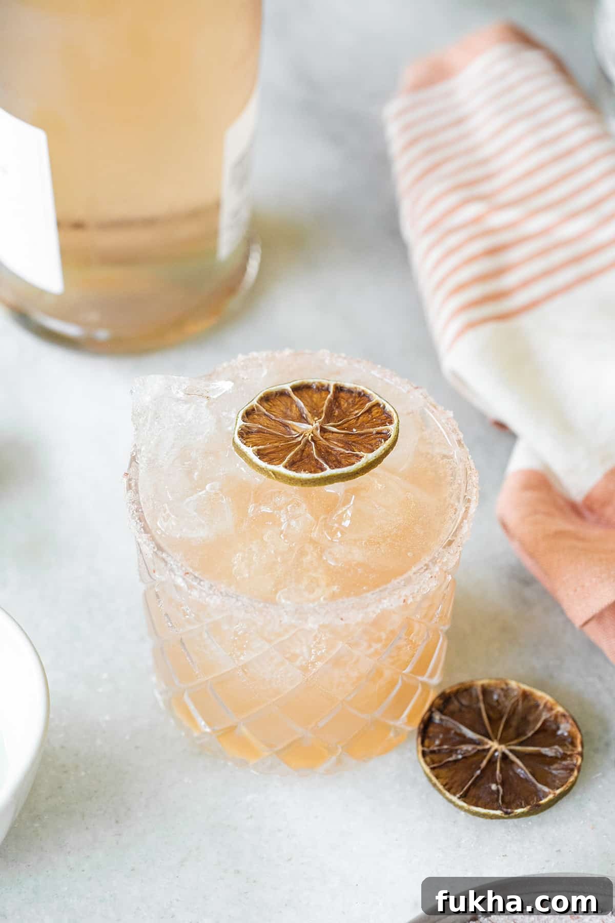 Margarita Recipes for Spring, Summer, Fall and Winter 11 Pink margarita in a glass with a salted rim.