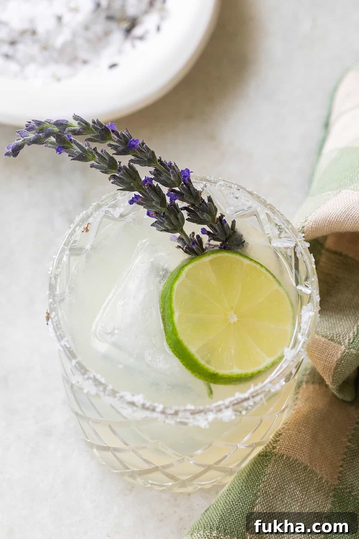 Margarita Recipes for Spring, Summer, Fall and Winter 4 Lavender margarita with a lime slice.