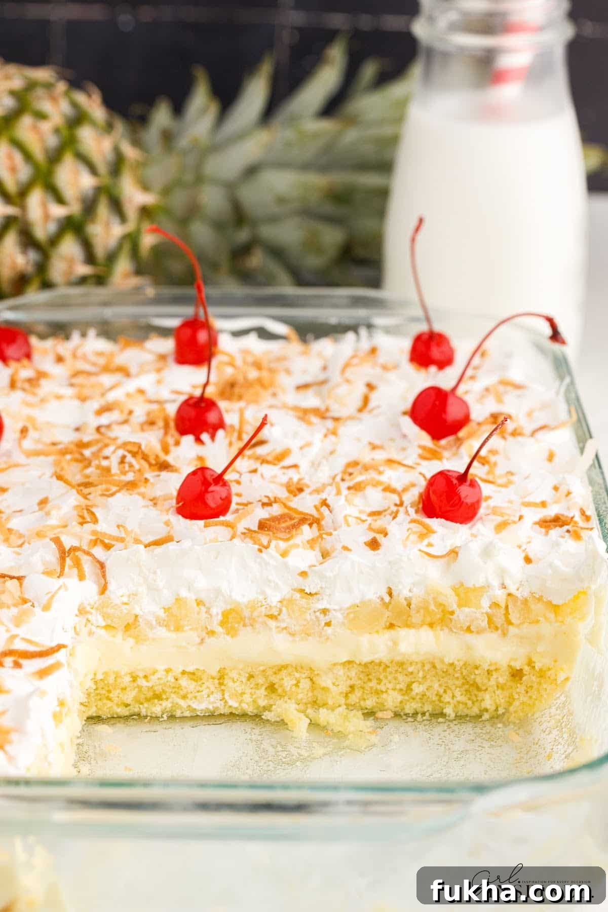 A 9x13 glass dish of Millionaire’s Cake with two slices missing.