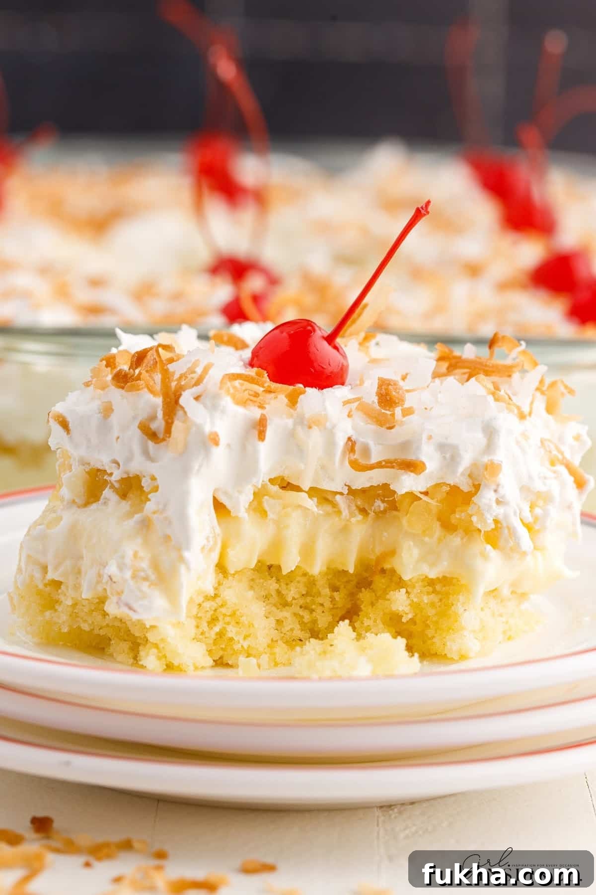 A slice of Millionaire’s Cake with a bite taken from it.