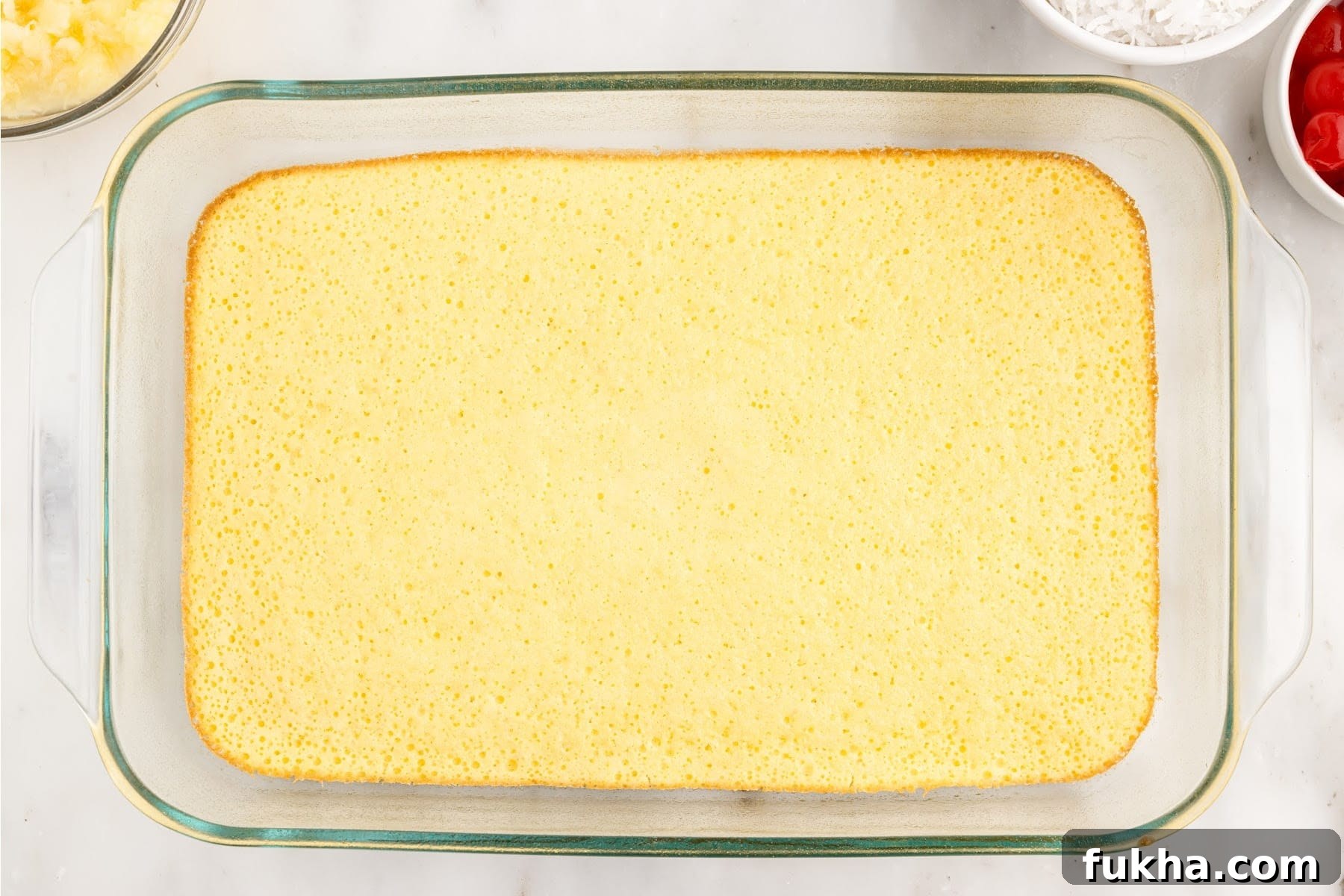Baked cake cooling in a 9x13 dish.