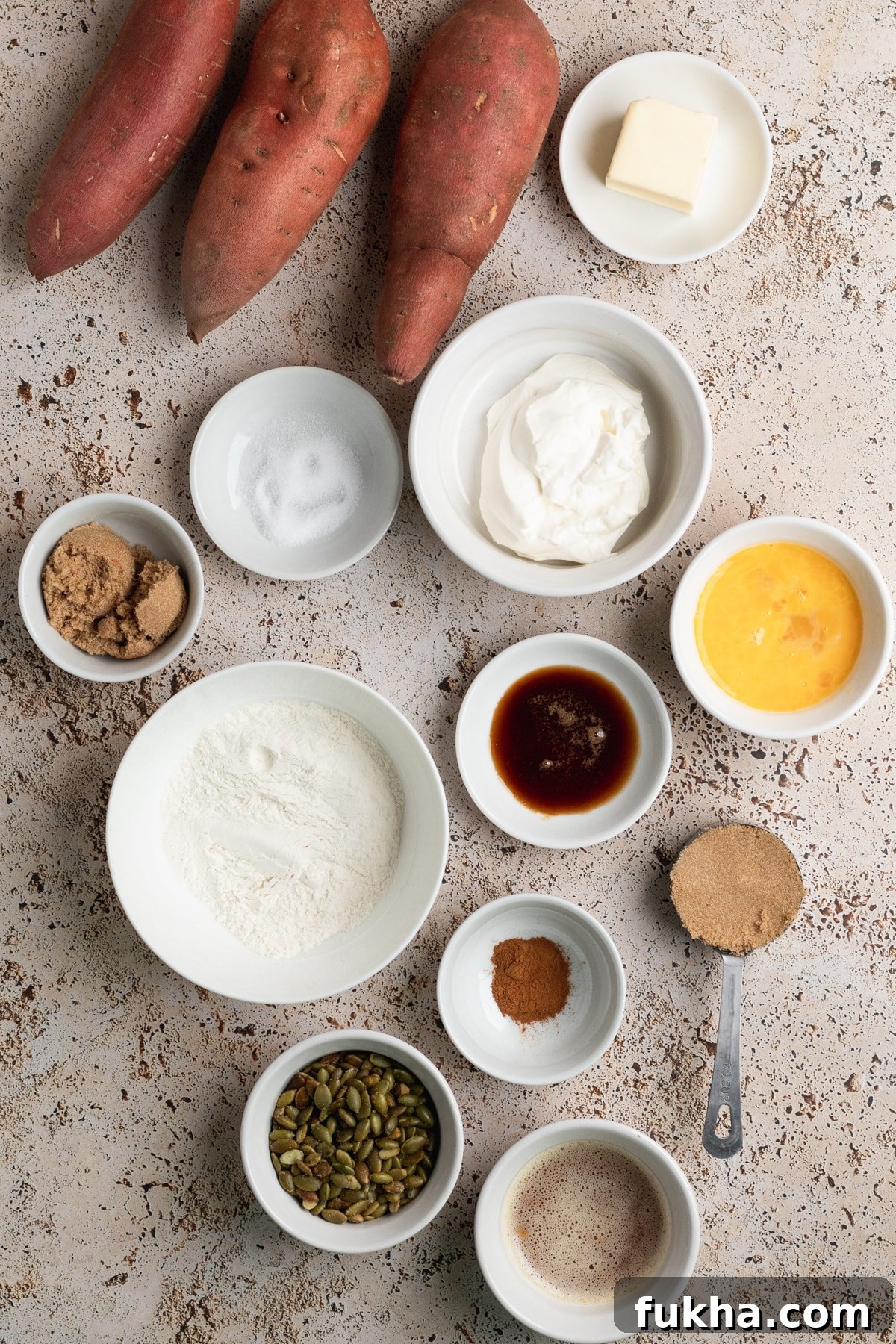 ingredients in small white dishes to make sweet potato casserole.