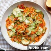 Simple Italian carrot and cucumber salad tossed in a light apple cider vinaigrette with chives and green onion.
