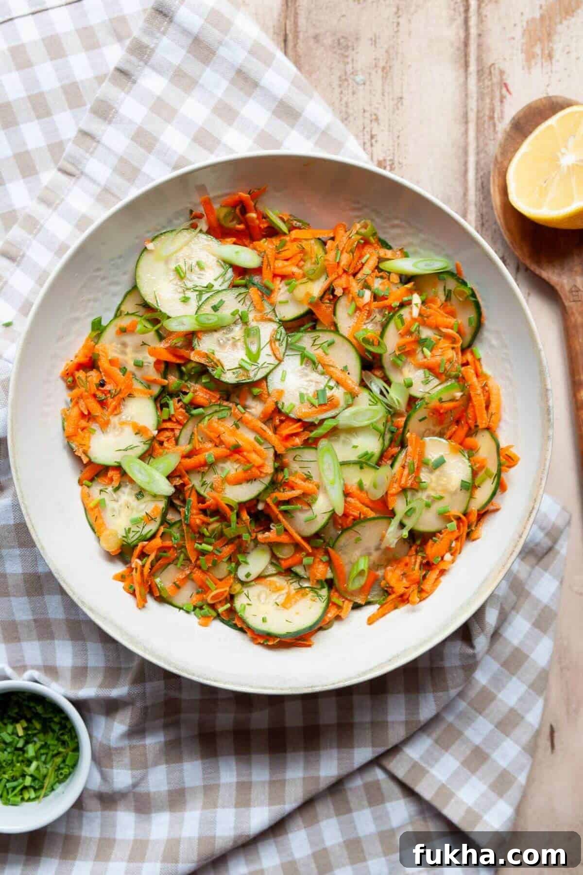 Fresh and simple cucumber carrot salad with chives, green onion, and an a easy vinaigrette without mayo.