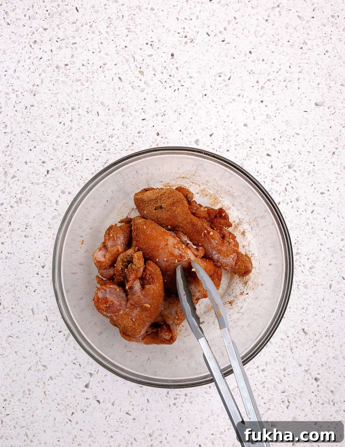a bowl of seasoned chicken thighs